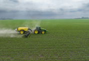 a few farm machines in a field